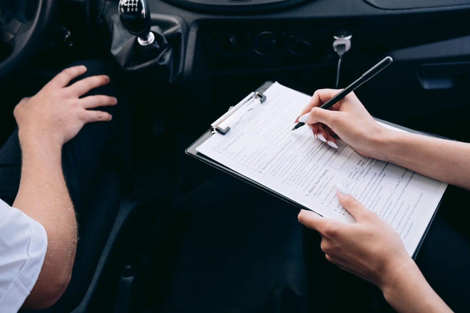 Rental car insurance best price comparison at an airport counter