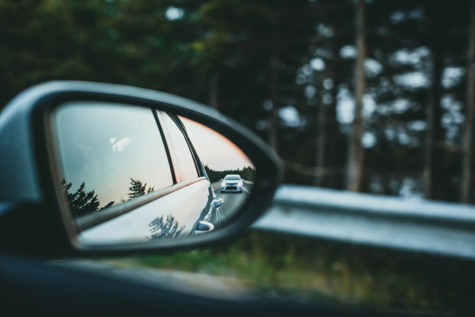 Rental car insurance policy documents and car keys on a desk