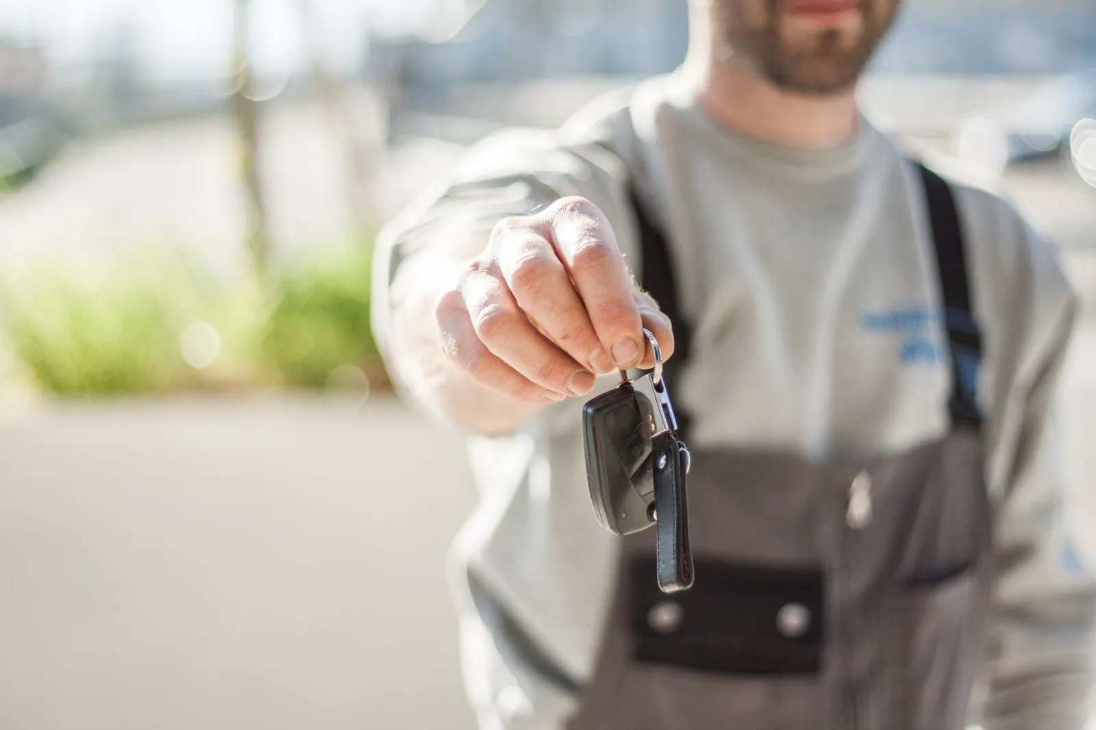 Driver reviewing personal auto insurance coverage on a rental car trip